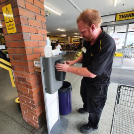 Sanitising hands at Pak'nSave