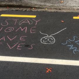 Chalked "Stay Home, Save Lives, Stay Safe" street message, Heretaunga