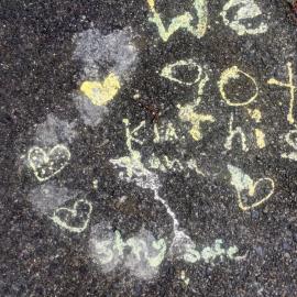 "We got this, kia kaha, stay safe" message painted on pavement, Pinehaven