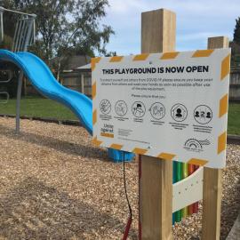 Level 2 "Playground Now Open" sign