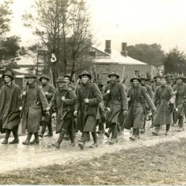 Troops marching through Upper Hutt in the rain, 1916