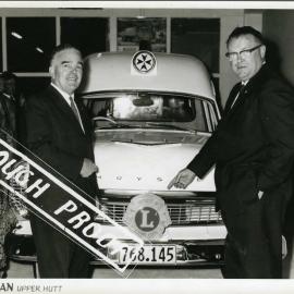 Lions Club president Bill Downs, district governor Ron Usmak at hand-over of new Chrysler ambulance.