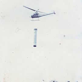 Chimney being helicoptered into Dunlops 