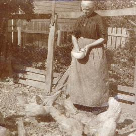 Ellen Scott feeding chickens