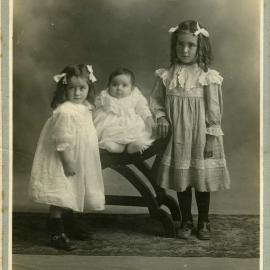 Studio portrait of three unidentifed children, c. 1900