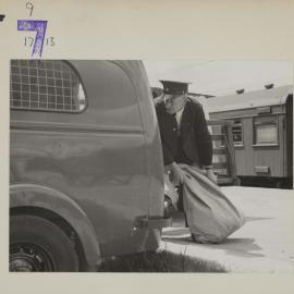 Clearing Mail at Upper Hutt from Suburban Train; 1954