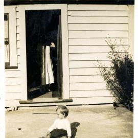 Sharman Marsh Family Photo Album; Toddler Outside House; ca. 1930s