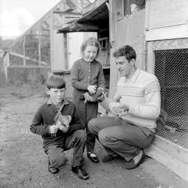 Harry Kent, cyclist (Gold medal at Commonwealth Games, 1970) with children and pigeons.