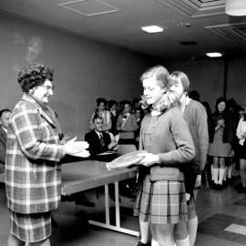 Schoolgirls and mayor Doris Nicholson; Red Cross girls in background; prizegiving. [P1-3381-5771]