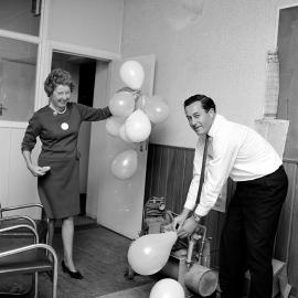 Hazelwoods Women's Day; Colin Gibbs and Mrs Codyre inflating balloons.