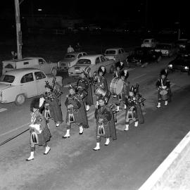 Night procession; pipe band.